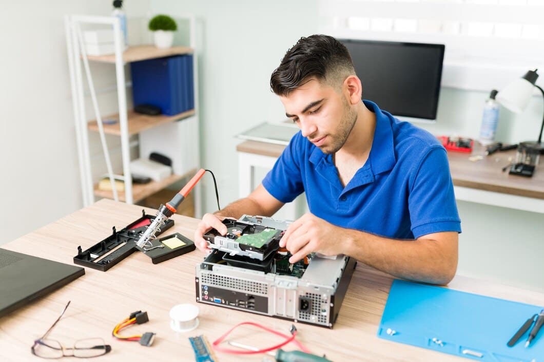young-man-finding-out-if-connection-works-hispanic-technician-connecting-new-hard-drive-computer-checking-hardware_662251-157